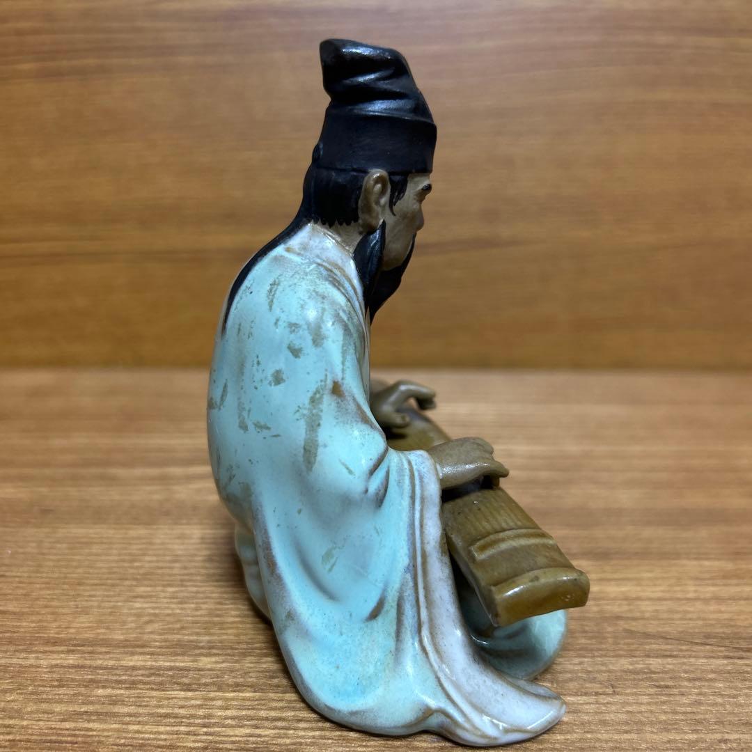 Japanese-style figure with a hichiriki, made of ceramic